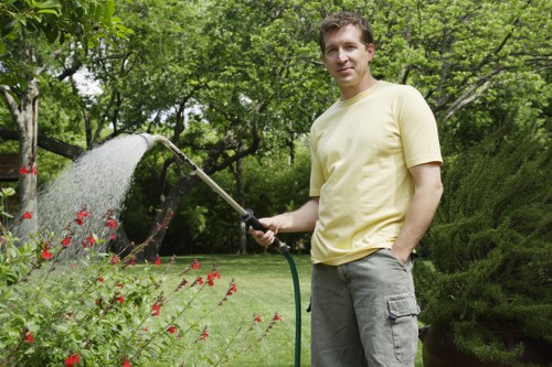 Well-maintained garden in White City with tidy lawn and planting beds